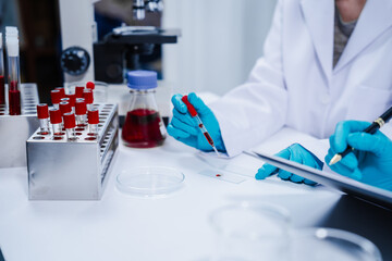 Professional scientists in lab working with blood samples. to find components in blood Ideas for...