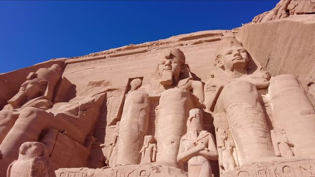 Abu Simbel, Egypt: Majestic statues of Ramses II that ornate the facade of the famous Abu Simbel temple in Upper Egypt. 