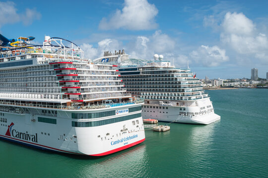 San Juan, Puerto Rico - Nov 22, 2023: Carnival Cruise Line Celebration ship and Princess Cruises Sky ship in port of San Juan. Rear view.