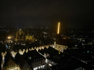 Drone aerial of Muster, Germany, at night, Christmas market