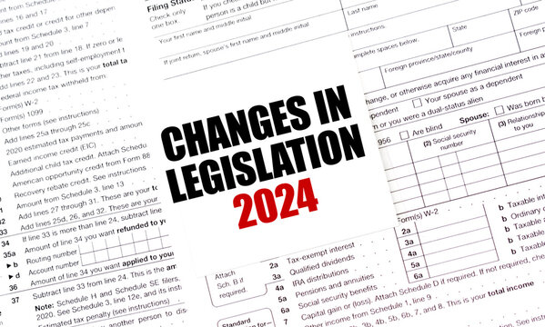CHANGES IN LEGISLATION 2024 on white sticker with tax forms