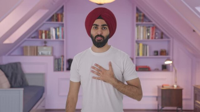 Guilty Sikh Indian man saying sorry and apologizing