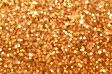 Golden brown light shiny sparkling texture background. New Year, Christmas and Celebration background conept.