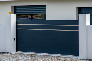 dark gray slide aluminum and silver chrome gate sliding portal of suburb house door entry