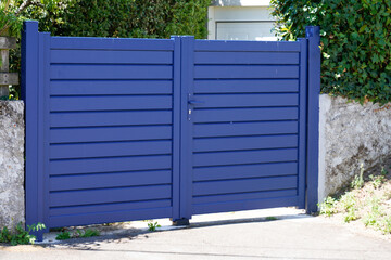 door home entrance access aluminum blue high gate new portal grey of residential suburb facade house