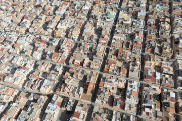 Symmetrically distributed city streets. Sunny day. View from the plane. Aerial view of Grammichele, a town near Catania, Sicily, Italy. 
