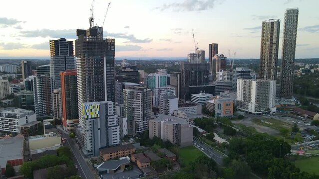 Aerial drone descending view of Parramatta cbd in Sydney, NSW Australia during a late afternoon in December 2023     