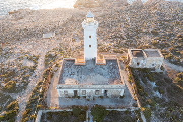 Summer Capo Murro di Porco old abandoned lighthouse - Syracuse, Sicily, Italy, Mediterranean sea.
A beautiful sunny day by the seashore. An active holiday.