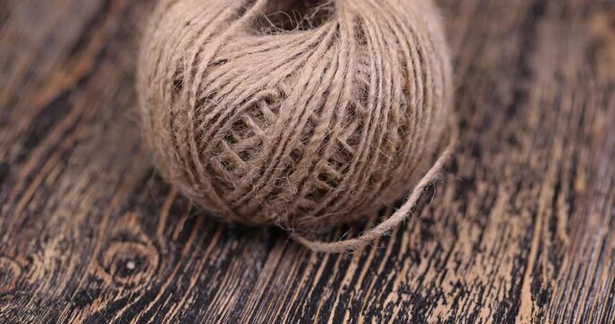 rough linen rope close-up, rough rope on a wooden table