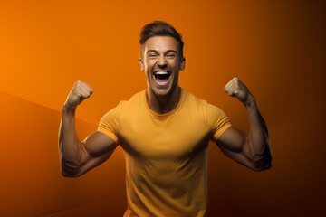 fitness man show his muscles on orange background