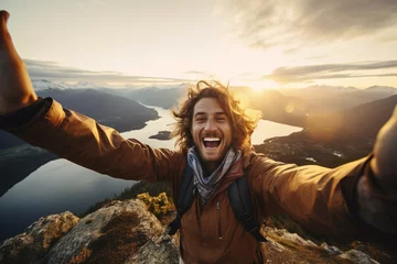 Zelfklevend Fotobehang male hiker taking selfie on the mountain © toonsteb