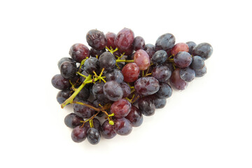 Bunch of organic black grapes isolated on white background.