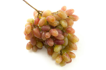 Bunch of organic pink grapes isolated on white background.
