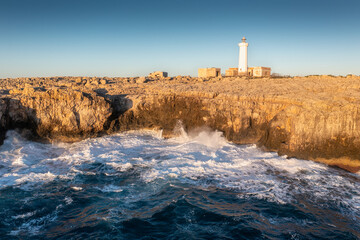 Summer Capo Murro di Porco old abandoned lighthouse - Syracuse, Sicily, Italy, Mediterranean sea.
A beautiful sunny day by the seashore. An active holiday.