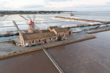 Sunset at Windmills in the salt evoporation pond in Marsala, Sicily island, Italy
Trapani salt...