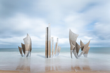 Saint-Laurent-sur-Mer, France. The monumental sculpture "Les Braves" by Anilore Banon was erected on Omaha Beach in 2004 for the 60th anniversary of the WWII Normandy landings.
