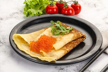 Russian pancake with red caviar