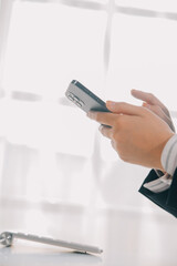 .Young woman using apps on a mobile touchscreen smartphone. Concept for using technology, shopping online, mobile apps, texting, addiction, swipe up, swipe down.