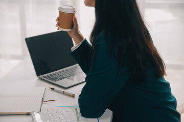 Thinking about how to take the business to technological heights. Cropped shot of an attractive young businesswoman working in her office.