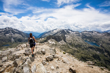 Young hiker girl summit to Montardo Peak in AIguestortes and Sant Maurici National Park, Spain - obrazy, fototapety, plakaty