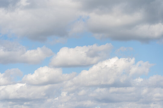 Photo texture of the sky with cumulus clouds.