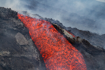 Eruptive vent with lava emis at the top of the Etna volcano