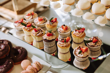 Almond cookies and various sweet cakes for a wedding banquet. A delicious reception, a luxurious...