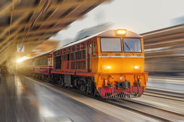 Obraz premium Locomotive diesel passenger train departs from the station speed motion blur