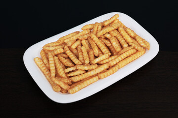 cheese-loaded French fries on a white background