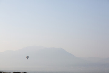 Lone balloon flying over the mountains of Turkey's hinterland