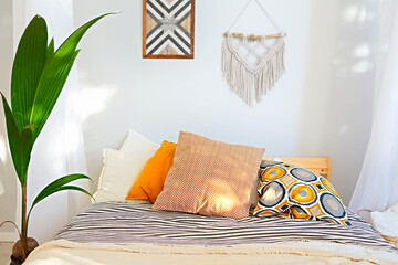White and beige bedroom in boho style