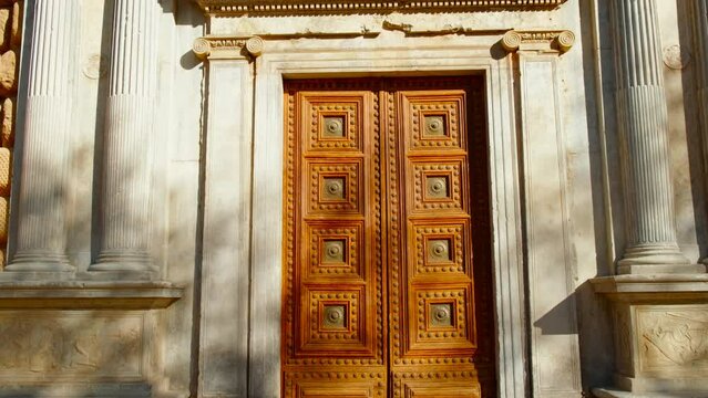The Alhambra Palace - Main facade of Palace of Charles V, Granada, Andalucia, Spain featuring Ionic columns and bas-reliefs