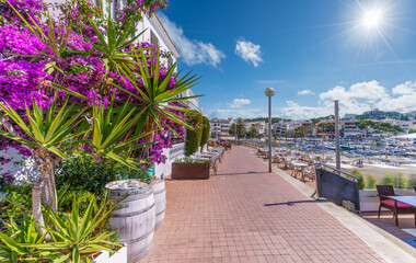 Stroll the vibrant promenade of Cala Ratjada, Mallorca, where the charm of a historic fishing port...