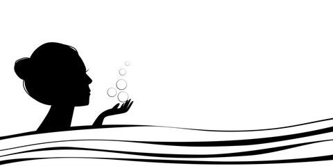 Girl's head in water with bubbles, spa treatments.
