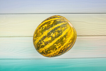 melon on wood background top view