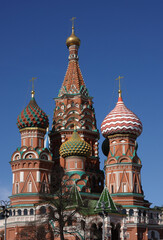 Cupolas of St. Basil's Cathedral on Red Square in Moscow Russia against blue cloudless sky
