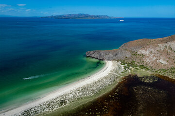 aerial sunset view of turquoise and green sea of wild mexico baja california panorama landscape