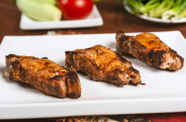 Caucasian shashlik plate with grilled meat .  pork bbq