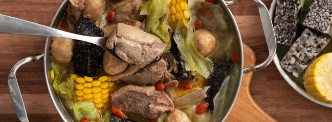 Delicious ginger duck hot pot soup with fresh vegetables in Taiwan.