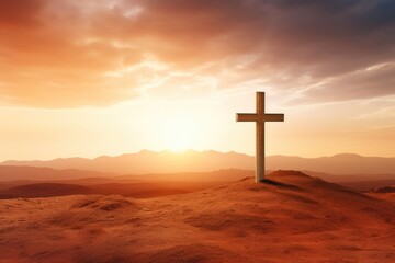 Christian cross on desert with sunrise background