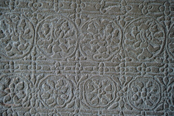 Ancient asian stone wall with flower ornaments in Cambodia Angkor Wat Siem Reap for pattern background 