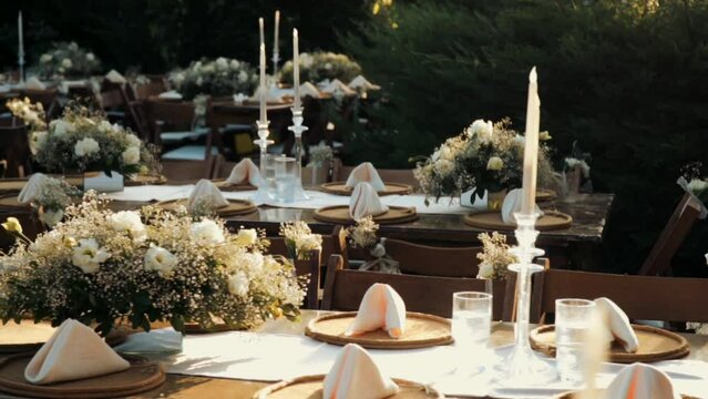 Wedding day event organization table setting decor luxury event. Wedding Decor. A large number of brown wooden chairs are lined up against the backdrop of the wedding decor. 