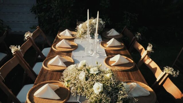 Wedding day event organization table setting decor luxury event. Wedding Decor. A large number of brown wooden chairs are lined up against the backdrop of the wedding decor. 