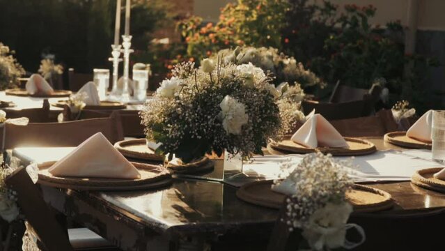 Wedding day event organization table setting decor luxury event. Wedding Decor. A large number of brown wooden chairs are lined up against the backdrop of the wedding decor. 