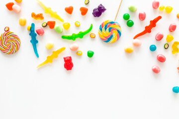 Flat lay of colorful candies and lollipop. Sweet food and candies background