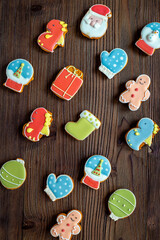 Pattern of Christmas cookies in the shape of a dragons and Santa. New Years decoration background