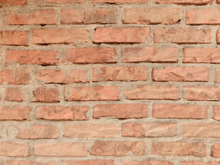 Texture of old dark brown and red brick wall background.