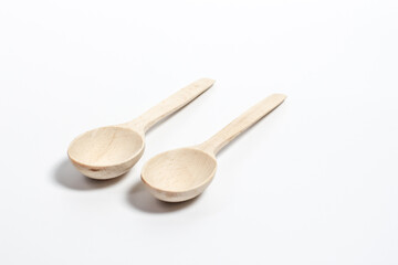 Wooden spoons on white background