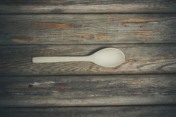 Wooden spoons on vintage background