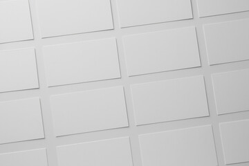 Blank business cards on white background, flat lay. Mockup for design